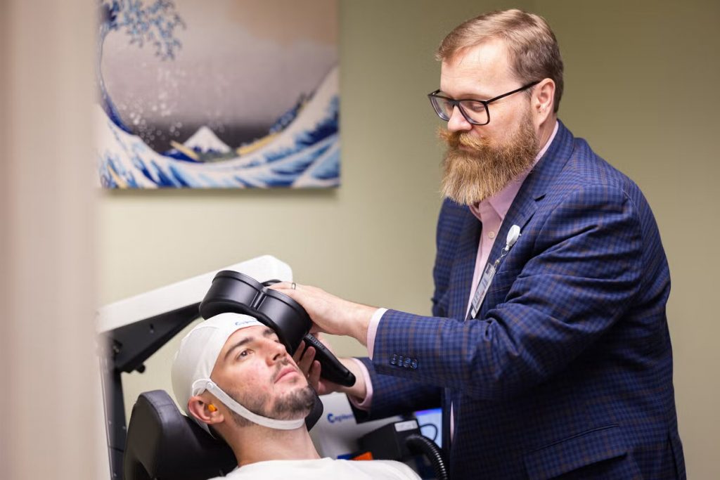 Yale neuroscientist Vaughn R. Steele testing whether a treatment known as transcranial magnetic stimulation can help people with alcohol and opioid addiction